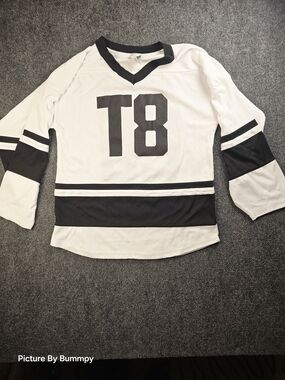 Athetic Knit Tate McRae #20 "T8" hockey jersey,  released as official tour merch